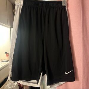 Black and white Nike basketball shorts. Size kids large.